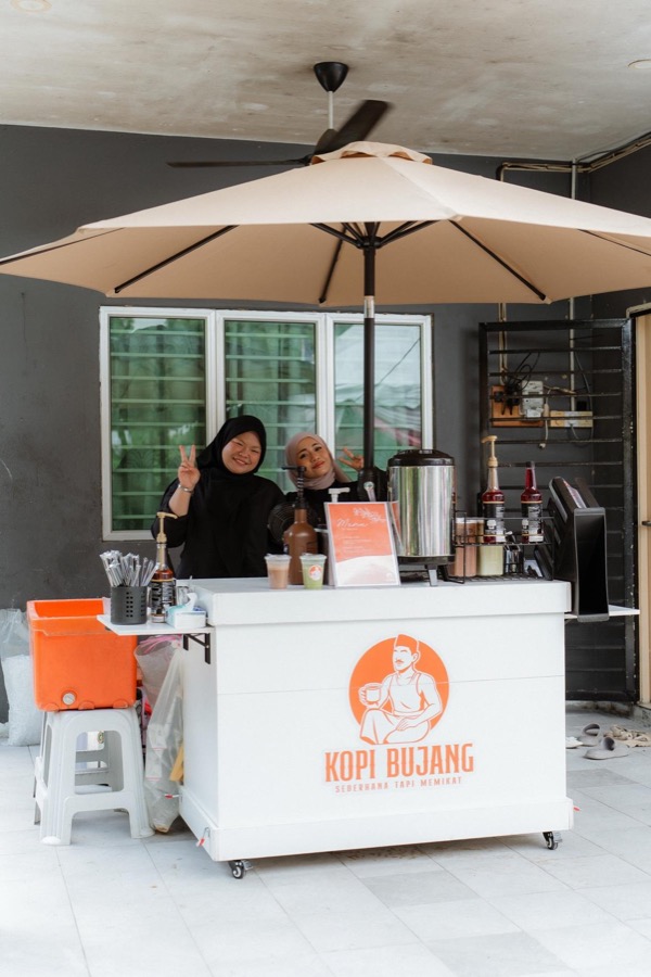 A Kopi Bujang mobile coffee cart at an outdoor event
