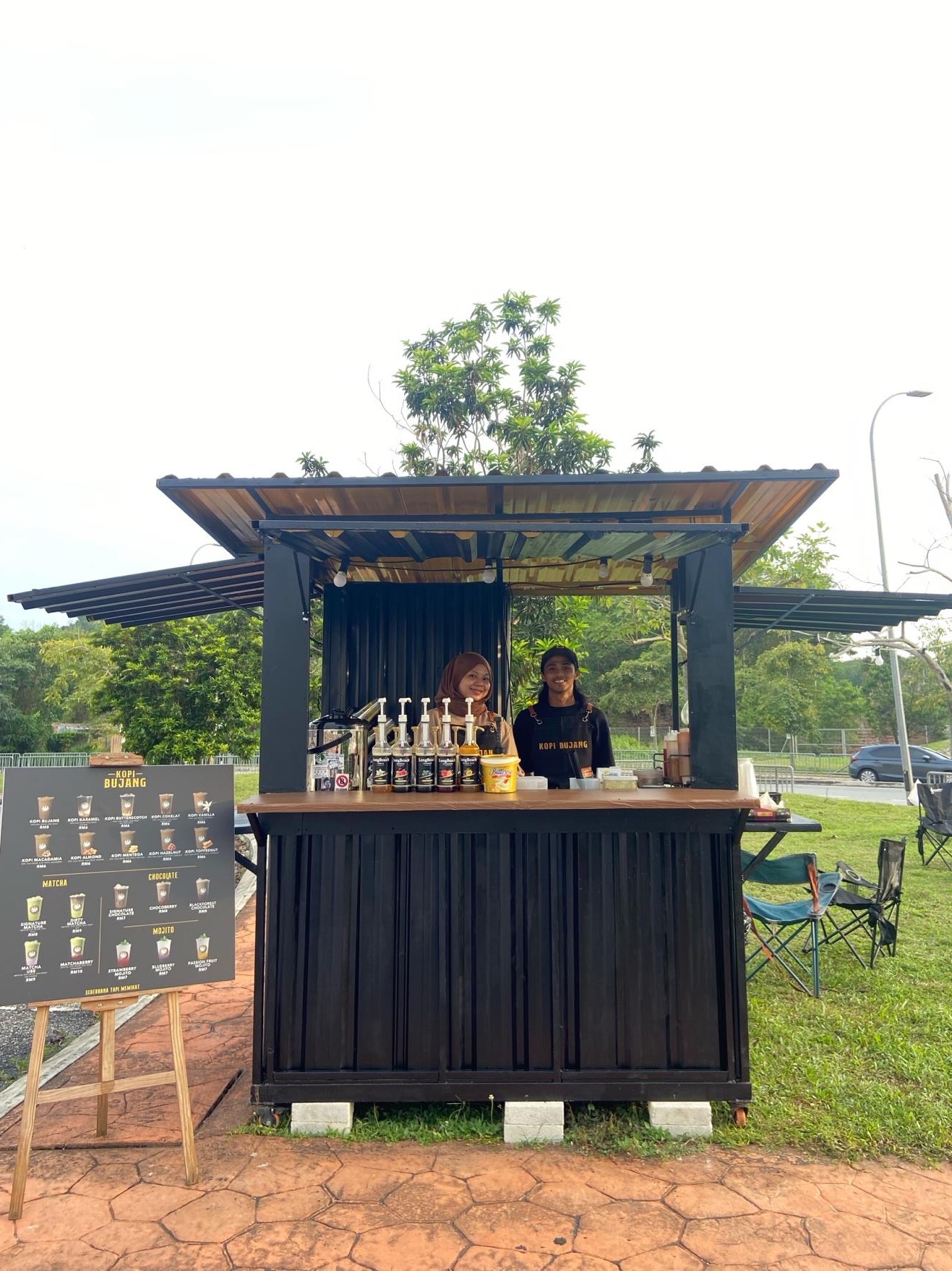The Kopi Bujang kiosk surrounded by trees